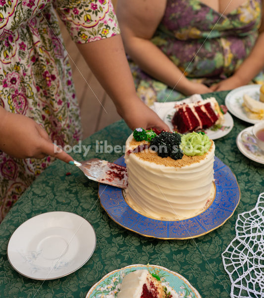 Woman Cuts Cake at Tea Party - Body Liberation Photos