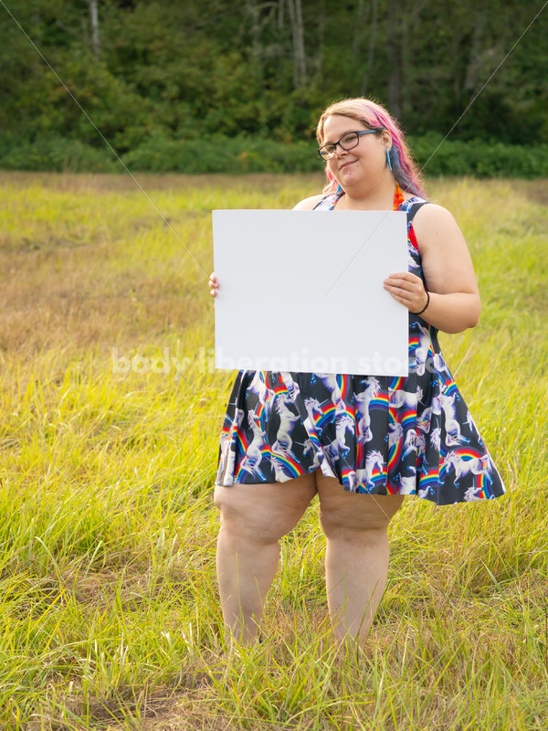 Blank Sign Stock Image: Woman in Field with Sign, Ready for Copy - Body Liberation Photos
