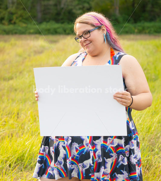 Blank Sign Stock Image: Woman in Field with Sign, Ready for Copy - Body Liberation Photos