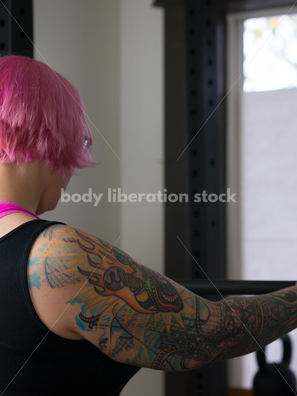 HAES Stock Photo: Female Weightlifter with Pink Hair Does Wide Stance Squat - Body Liberation Photos