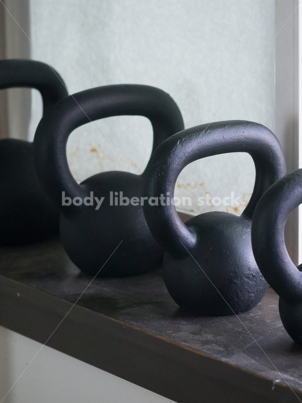 HAES Stock Photo: Kettlebell Weights on Gym Windowsill - Body Liberation Photos