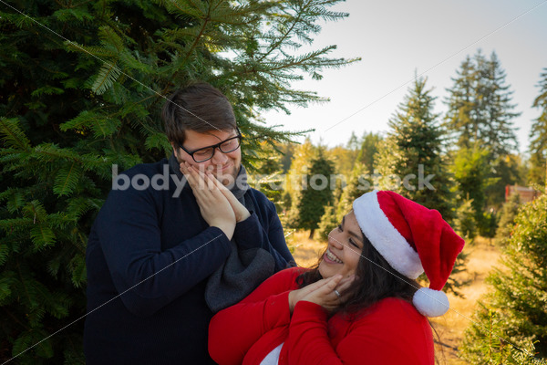 Holiday Stock Image: Plus-Size Couple at a Tree Farm - Body Liberation Photos