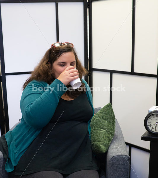 Hydrating in a medical office waiting room - Body Liberation Photos