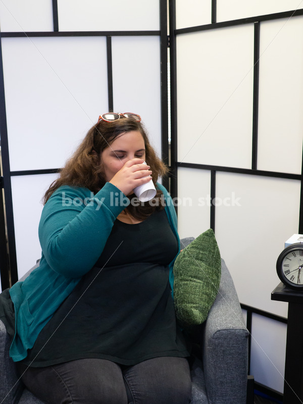 Hydrating in a medical office waiting room - Body Liberation Photos