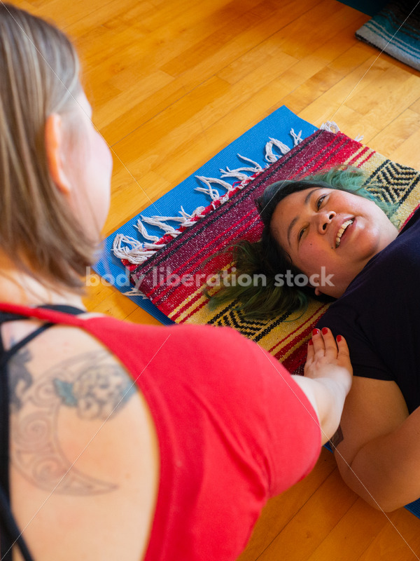 Inclusive Yoga Stock Photo: Yoga Instructor Interacting with Class - Body Liberation Photos