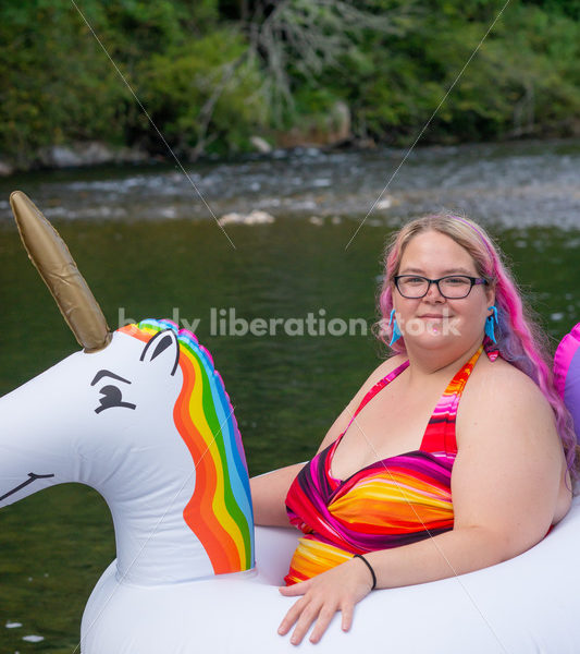 Plus-Size Lifestyle Stock Photo: Woman with Unicorn Float - Body Liberation Photos