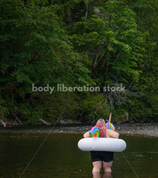 Plus-Size Lifestyle Stock Photo: Woman with Unicorn Float - Body Liberation Photos