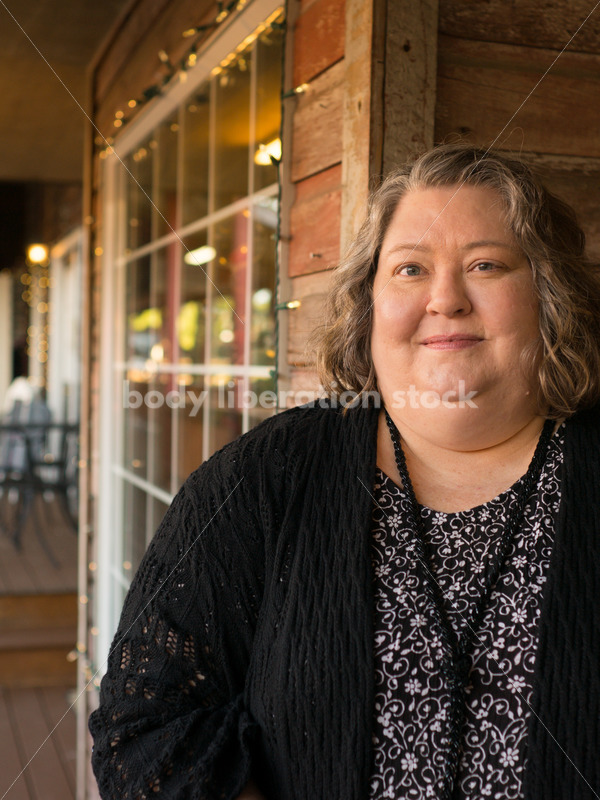 Plus Size Stock Photo: Woman in 50s with Rustic Wood Walls - Body Liberation Photos