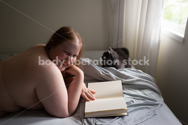 Self Care Stock Photo: Plus-Size Woman Reading in Bed - Body Liberation Photos