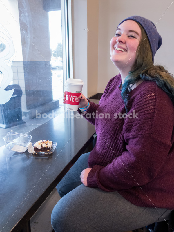 Young caucasian women enjoys coffee and a brownie - Body Liberation Photos