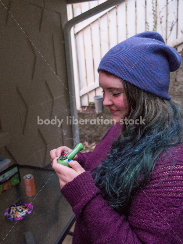 A young caucasian woman smokes legal marijuana in Washington state