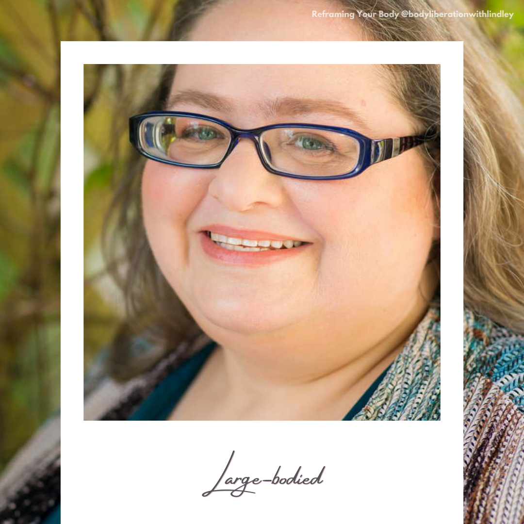A headshot of a fat white woman at a body-positive portrait session in Seattle, WA with glasses smiling at the camera outdoors. A faux polaroid frame is on top with today's word written on the frame.