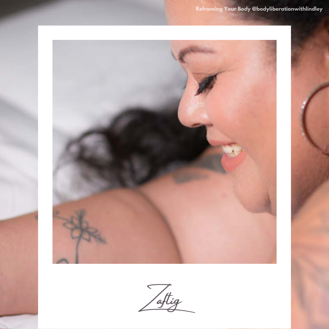 A fat Hawaiian woman lying on a bed and smiling, looking down. A faux polaroid frame is on top with today's healthy and positive body image word written on the frame.