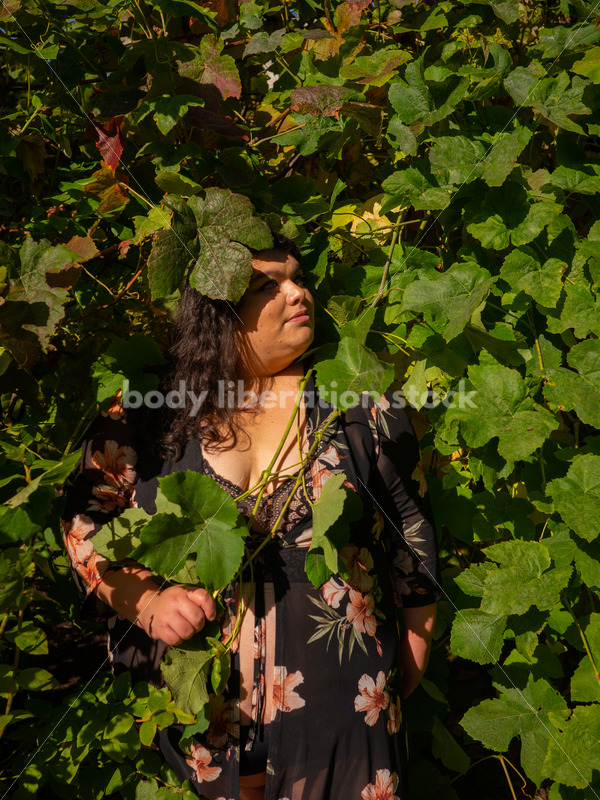 Size-Diverse Stock Photo: Woman Partially Hidden in Vines - Body liberation boudoir, portraits, stock, HAES & more | Seattle