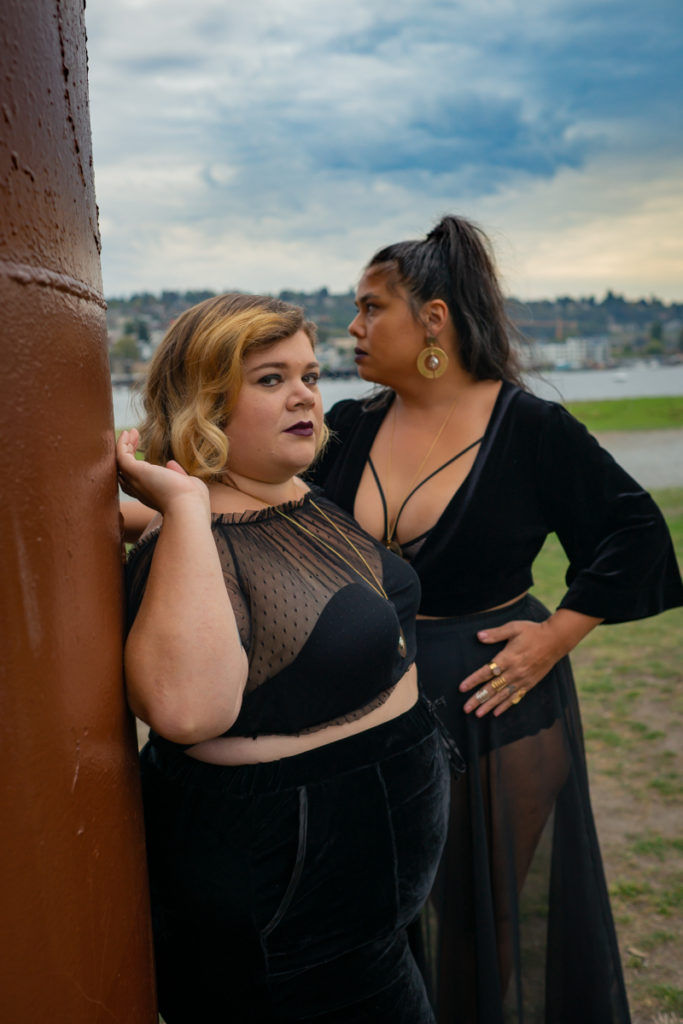 Two women pose together with sultry looks during an LGBT friendly photo shoot in the PNW