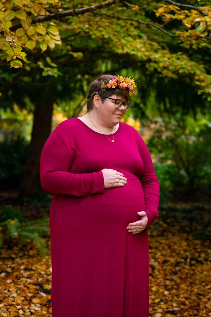 A fat pregnant woman during a portrait photo shoot outdoors in Seattle
