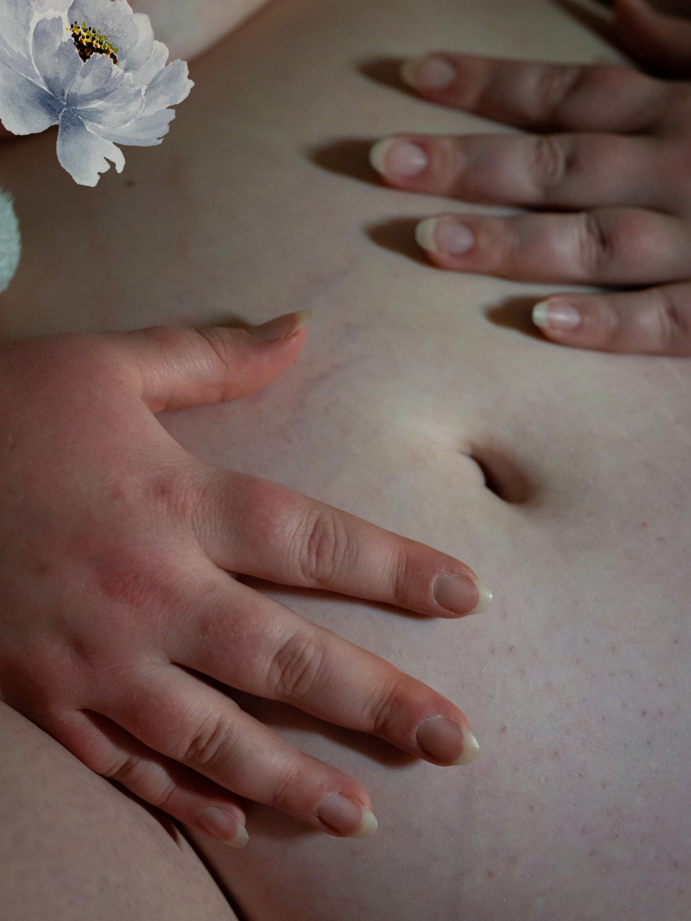 A fat woman's belly and hands in low light at a body liberation boudoir session in Seattle.