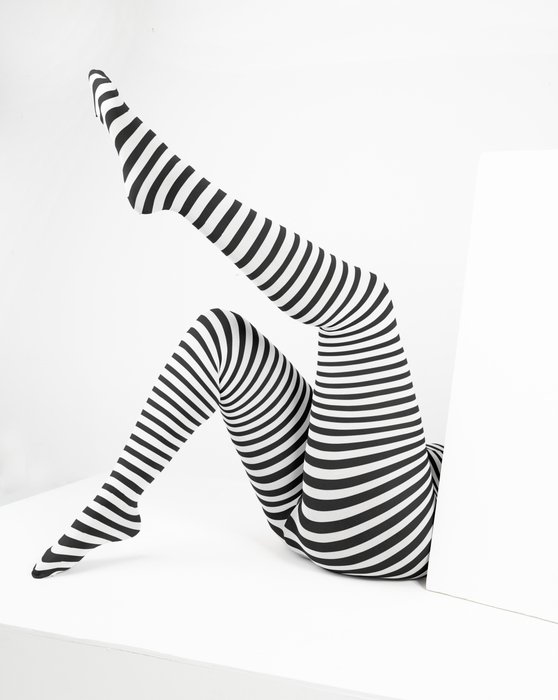 Image description: A pair of legs posing in black and white striped tights