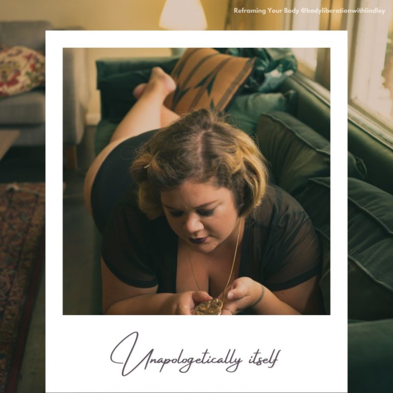 A woman lying on a velvet couch and looking down at the necklace pendant she's holding. A faux polaroid frame is on top with today's word written on the frame.