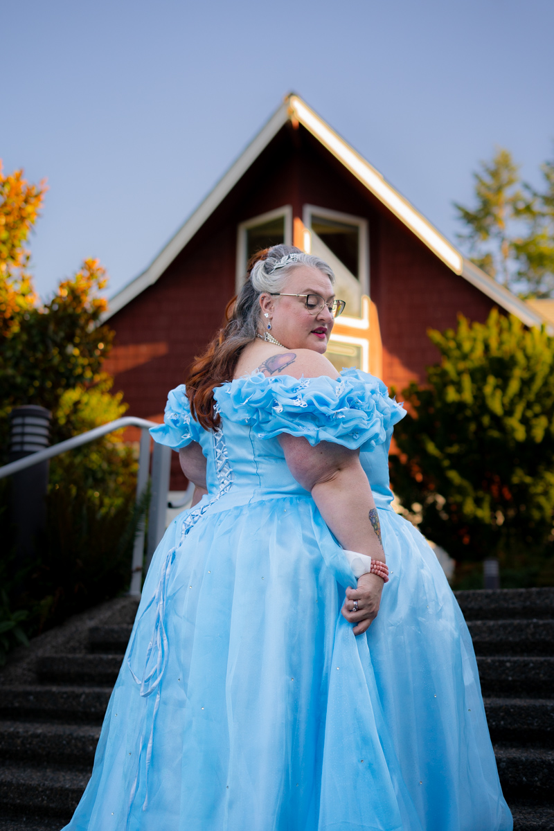 A plus-size woman in a Cinderella-style ballgown at a wedding in the Pacific Northwest.