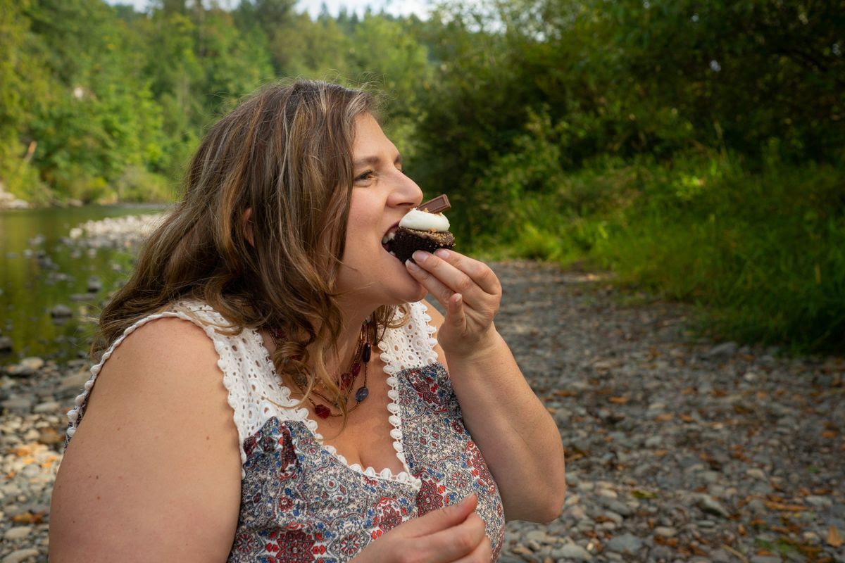 Model E. eating a cupcake at Flaming Geyser State Park.