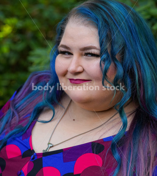 Body Liberation Stock Photo: A Plus Size Woman with Colorful Hair and a Sly Smile - It's time you were seen ⟡ Body Liberation Photos