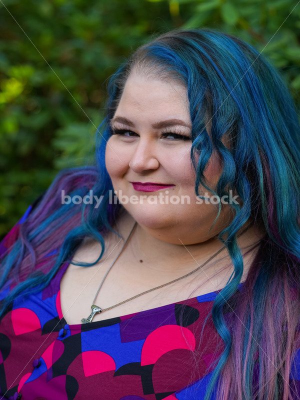 Body Liberation Stock Photo: A Plus Size Woman with Colorful Hair and a Sly Smile - It's time you were seen ⟡ Body Liberation Photos