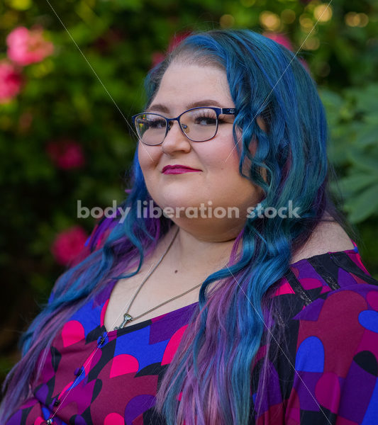 Body Liberation Stock Photo: A Plus Size Woman with Colorful Hair with a Penetrating Expression - It's time you were seen ⟡ Body Liberation Photos