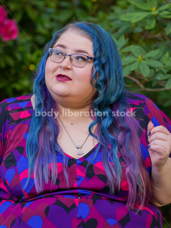 Body Liberation Stock Photo: A Plus Size Woman with Colorful Hair with a Ponderous Expression - It's time you were seen ⟡ Body Liberation Photos