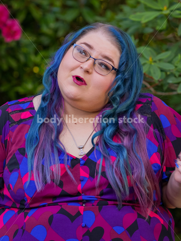 Body Liberation Stock Photo: A Plus Size Woman with Colorful Hair with a Ponderous Expression - It's time you were seen ⟡ Body Liberation Photos