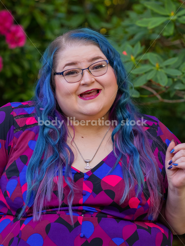 Body Liberation Stock Photo: A Plus Size Woman with Colorful Hair with a Triumphant Expression - It's time you were seen ⟡ Body Liberation Photos