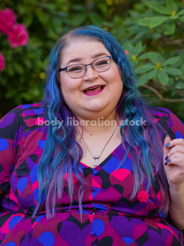 Body Liberation Stock Photo: A Plus Size Woman with Colorful Hair with a Triumphant Expression - It's time you were seen ⟡ Body Liberation Photos