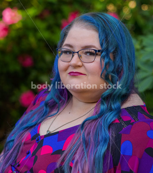 Body Liberation Stock Photo: A Plus Size Woman with Colorful Hair with a Withering Expression - It's time you were seen ⟡ Body Liberation Photos