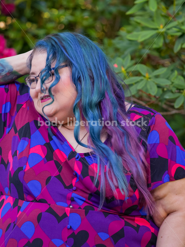 Body Liberation Stock Photo: A Plus Size Woman with Colorful Hair with an Embarrassed Expression - It's time you were seen ⟡ Body Liberation Photos