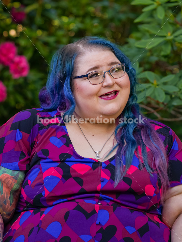 Body Liberation Stock Photo: A Plus Size Woman with Colorful Hair with an Embarrassed Expression - It's time you were seen ⟡ Body Liberation Photos