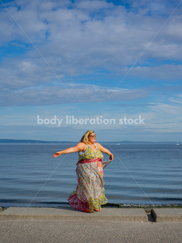 Body-Positive Stock Photo: Plus Size Woman Dancing in Front of the Ocean - It's time you were seen ⟡ Body Liberation Photos