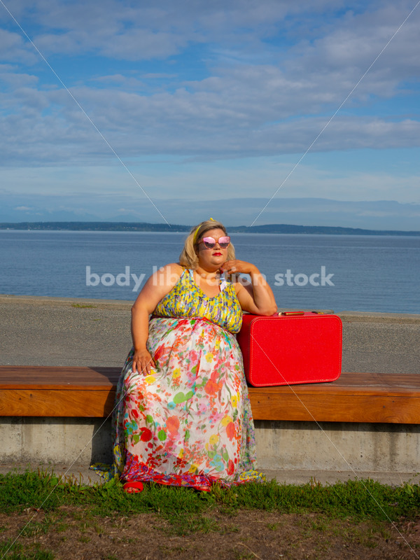 Body-Positive Stock Photo: Plus Size Woman Sitting on a Bench Leaning on a Suitcase - It's time you were seen ⟡ Body Liberation Photos