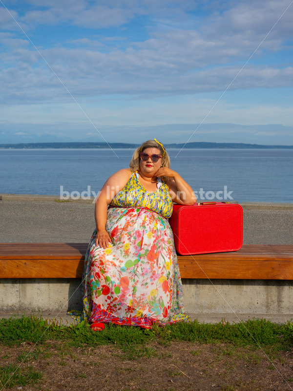 Body-Positive Stock Photo: Plus Size Woman Sitting on a Bench Leaning on a Suitcase - It's time you were seen ⟡ Body Liberation Photos
