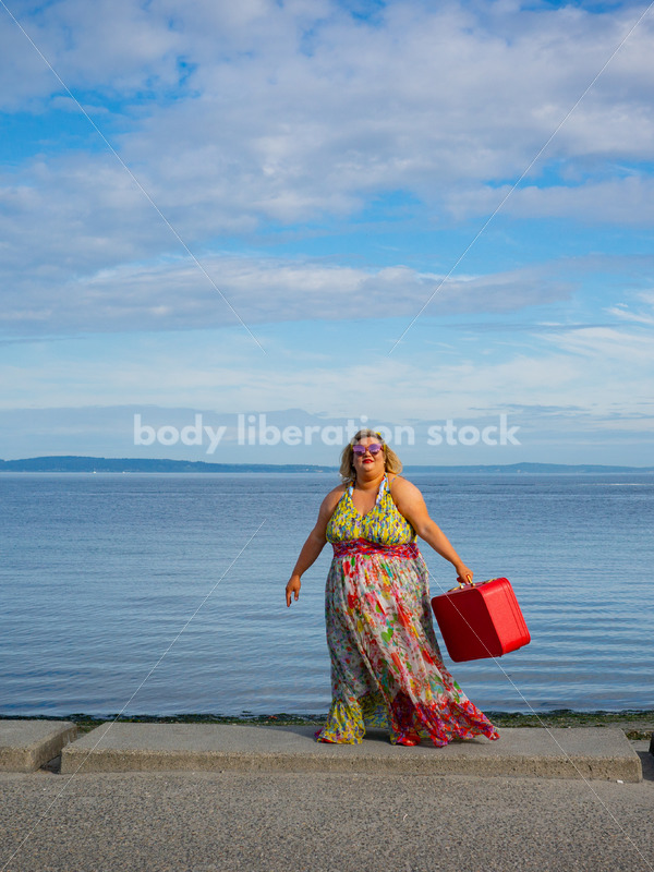 Body-Positive Stock Photo: Plus Size Woman Swinging a Suitcase on the Beach - It's time you were seen ⟡ Body Liberation Photos