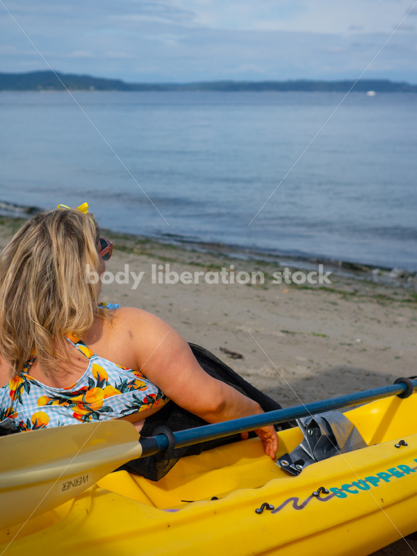 Body-Positive Stock Photo: Plus Size Woman in a Blue Swimsuit and Skirt Coverup Looking Over the Water - It's time you were seen ⟡ Body Liberation Photos