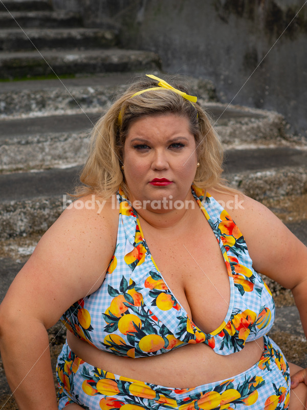 Body-Positive Stock Photo: Plus Size Woman in a Swimsuit Sits on Mossy Stone Stairs at the Beach - It's time you were seen ⟡ Body Liberation Photos