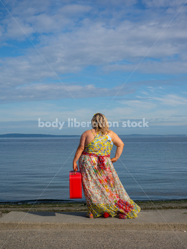 Body-Positive Stock Photo: Plus Size Woman on the Beach Holding a Red Suitcase - It's time you were seen ⟡ Body Liberation Photos