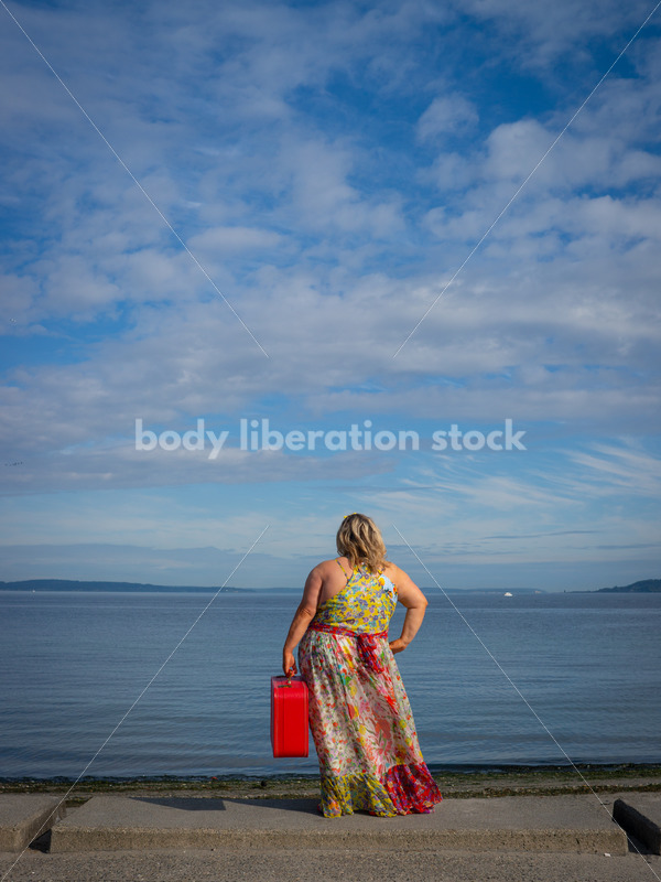Body-Positive Stock Photo: Plus Size Woman on the Beach Holding a Red Suitcase - It's time you were seen ⟡ Body Liberation Photos