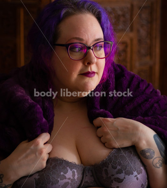 Fat-Positive Stock Photo: Plus-Size Woman Looks Off Camera Wearing a Purple Cape - Body Liberation Photos