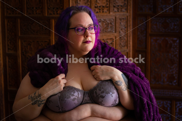 Fat-Positive Stock Photo: Plus-Size Woman Looks Off Camera Wearing a Purple Cape - Body Liberation Photos