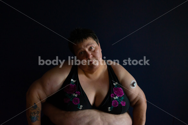 Plus Size Stock Photo: Woman in Dark Room - Body Liberation Photos