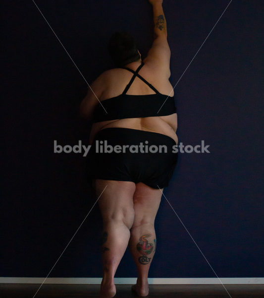 Plus Size Stock Photo: Woman in Dark Room - Body Liberation Photos