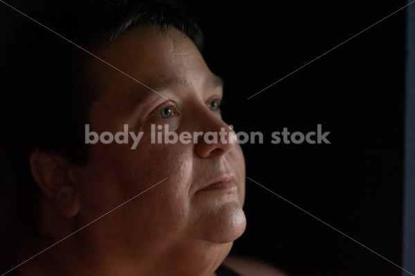 Plus Size Stock Photo: Woman in Dark Room - Body Liberation Photos