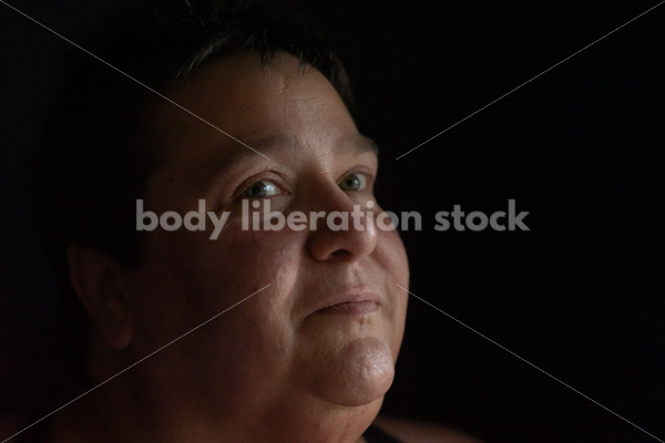 Plus Size Stock Photo: Woman in Dark Room - Body Liberation Photos