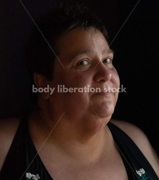 Plus Size Stock Photo: Woman in Dark Room - Body Liberation Photos